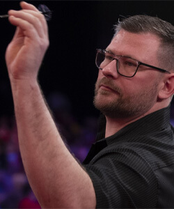 James The Machine Wade Left-Handed Dart Player Throwing a Dart