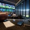 A bettor checks NFL odds and a sportsbook app on a laptop before kickoff.